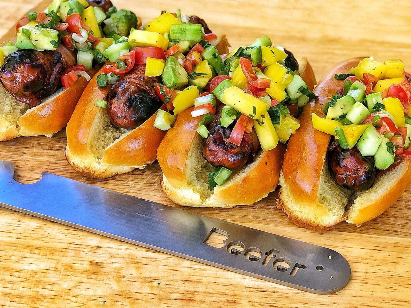 Bacon Wrapped Sausages with Mango, Avocado and Cucumber Salsa from the Beefer