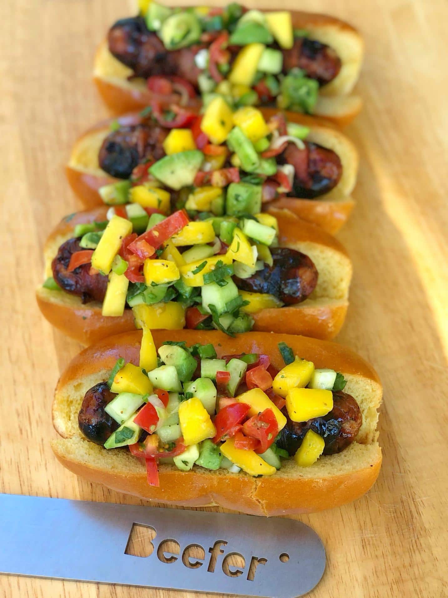 Bacon Wrapped Sausages with Mango, Avocado and Cucumber Salsa